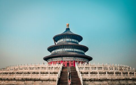 blue and white concrete building under blue sky during daytime