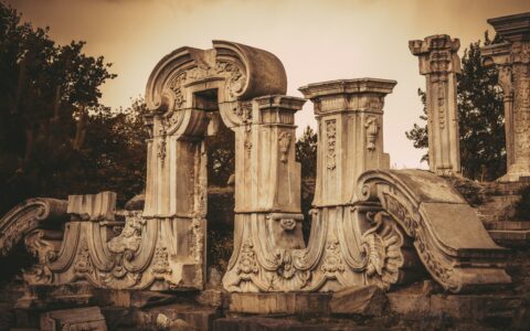 a group of stone pillars sitting next to each other