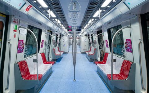 red and white train in train station
